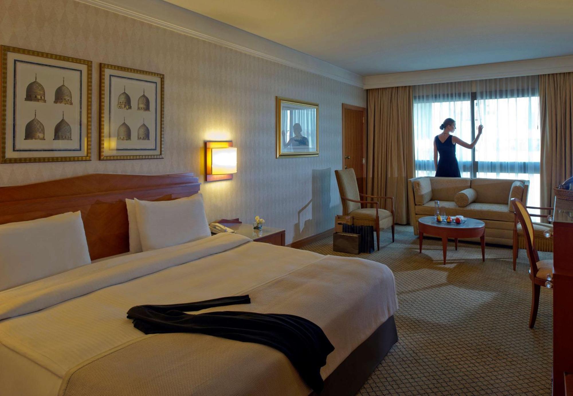 Radisson Blu Martinez Beirut Hotel Bagian luar foto A maid cleaning a hotel room
